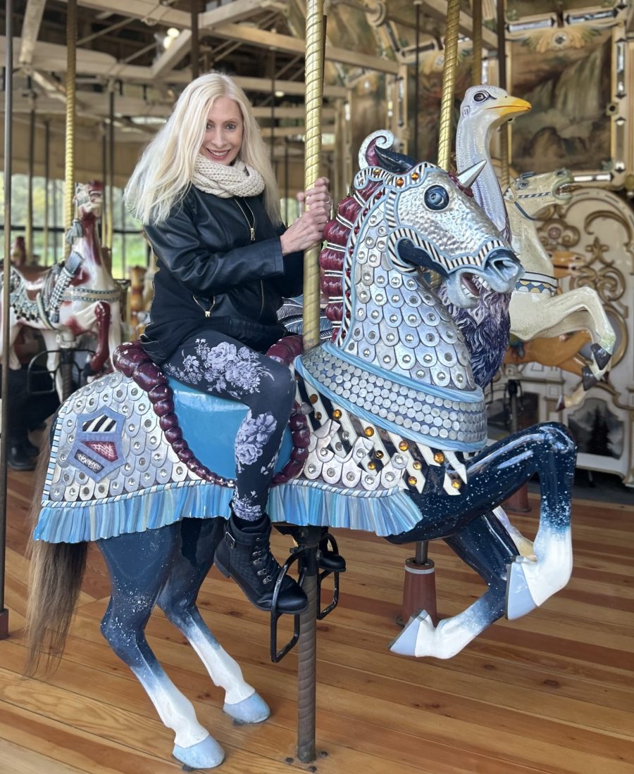 Gina Befera riding a unicorn in San Francisco.